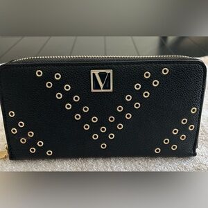VICTORIA’S SECRET WRAP AROUND ZIPPERED WALLET.  BLACK WITH GOLD ACCENTS.
